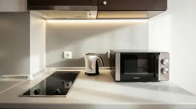 a microwave sitting on top of a kitchen counter at Mountain Paradise 2 - Quiet Cosy Studio - Balcony, Wifi in Bansko