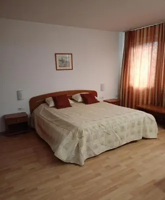 a bedroom with a large bed in a room at Mountain Paradise 1 - 1 Bedroom South facing balcony - 300mbps Wi-fi in Bansko