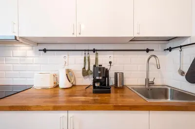 a kitchen with a counter top with a sink at Top Centre 1 Bedroom Apt next to Vitosha Blvd. in Sofia