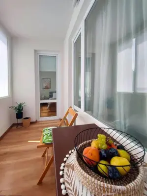 a basket of fruit on a table in a room at Specious Modern Apartment in Sofia