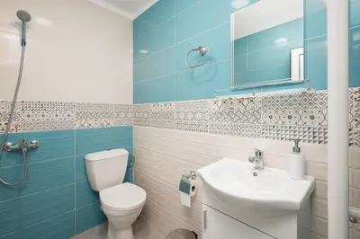 a bathroom with a toilet and a sink at Serdika Old City House in Sofia
