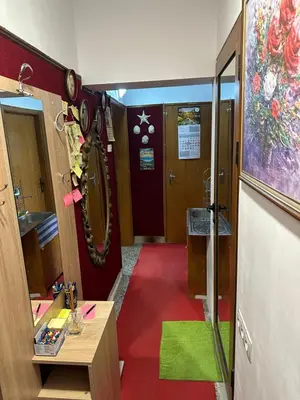 a bathroom with a red floor and a red carpet at Sleep & fly in Sofia