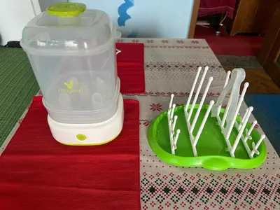a blender sitting on a table next to a green plate at Sleep & fly in Sofia