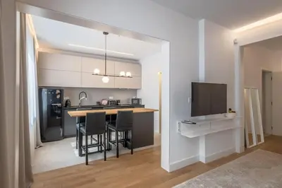 a kitchen with a table and chairs in a room at Top-Notch location, an Exceptionally Stylish flat in Sofia