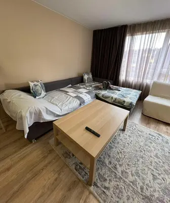 a bedroom with a bed and a coffee table at Johannesburg 2BDR Spacious Family apt w Parking and Playground in Sofia