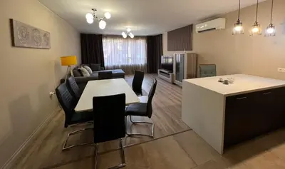 a kitchen and living room with a table and chairs at Johannesburg 2BDR Spacious Family apt w Parking and Playground in Sofia