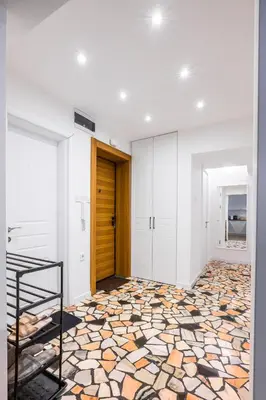 an empty room with a hallway with a tile floor at Contemporary Comfort 1BD Flat in Lozenetz, Sofia by Flat Mаnager in Sofia