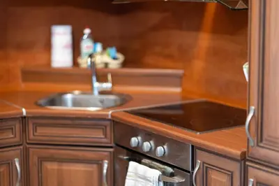 a kitchen with a sink and a stove at Karastoyanovi's apartment 3 in Sofia