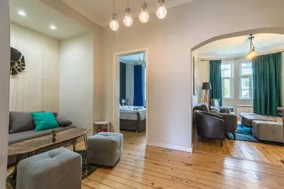 a living room with a couch and a table at 5 Seconds Away from the Main Street, FREE Secured Parking in Sofia