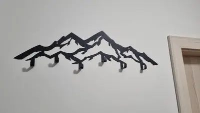 a black and white mountain design on a wall at Cozy Riverside Pine Studio E5 in Borovets