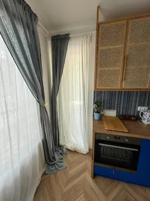 a room with a window with curtains and a table at Royal Blue River Pearl in Sandanski