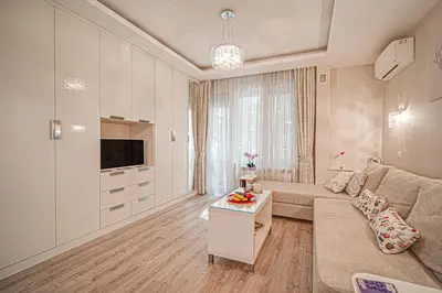 a living room with a couch and a tv at Cappuccino Dream in Sofia