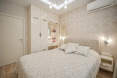 a bedroom with a large bed with two pillows at Cappuccino Dream in Sofia