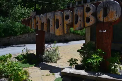 a wooden sign that says happy park at Forest view in Pamporovo