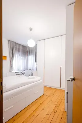 a white bathroom with a large bed in a room at Colorful Getaway right next to NDK by Flat Mаnager in Sofia