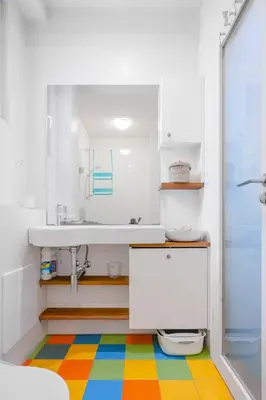 a bathroom with a sink and a colorful floor at Colorful Getaway right next to NDK by Flat Mаnager in Sofia