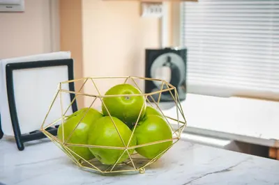 a basket of green apples sitting on a counter at Forest Oasis Guest House FREE PARKING in Sapareva Banya
