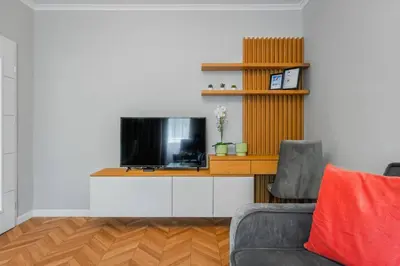 a living room with a tv and a couch at Lozenets Apartment in Sofia