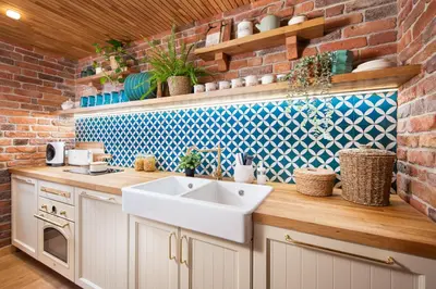 a kitchen with a sink and a brick wall at Alexandra's City Center Apartment III in Sofia
