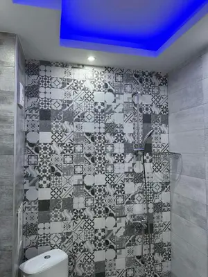 a bathroom with a shower and a toilet at Апартаменти в сърцето на парка in Sandanski
