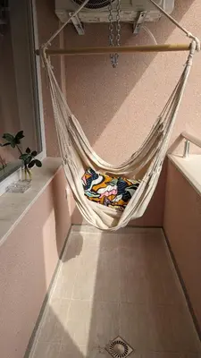 a hammock hanging from a wall in a room at 65 Duck House in Sofia