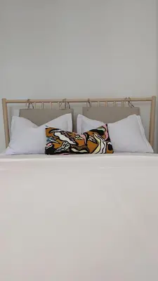 a bed with two pillows on top of it at 65 Duck House in Sofia