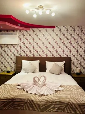a bedroom with a bed with a heart on it at Eda Aparts in Devin