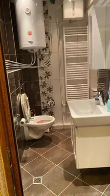 a bathroom with a toilet and a sink at Eda Aparts in Devin