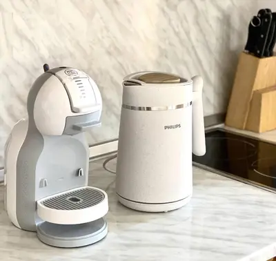 a juicer and a coffee maker on a counter at Light One Bed Flat next to the Ski Lift in Bansko