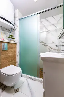 a bathroom with a shower and a toilet and a sink at West Haven Apartments - 1BDs in Plovdiv Centre by Flat Mаnager in Plovdiv