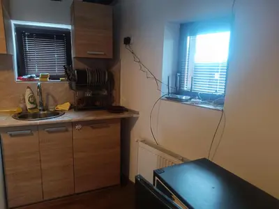 a small kitchen with a sink and a window at Guest Rooms Didka in Koprivshtitsa