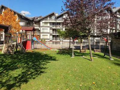 a park with a playground with a slide at Apartment ZAX B7 in Terra Complex in Bansko