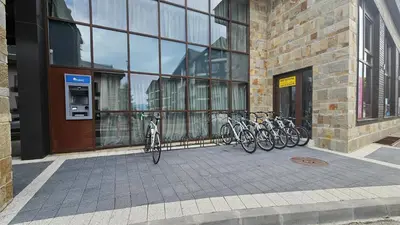a group of bikes parked in front of a building at Apartment ZAX B7 in Terra Complex in Bansko