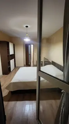 a bedroom with a bed and a mirror at Budget overnight- Struma highway in Pernik