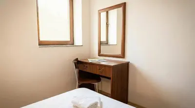 a bedroom with a dressing table and a mirror at Mountain Paradise 4 - 1 Bedroom - Gondola, 100m away - Washer in Bansko