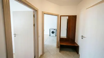 a hallway with a door to a room with a microwave at Mountain Paradise 4 - 1 Bedroom - Gondola, 100m away - Washer in Bansko