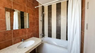 a bathroom with a sink and a tub and a mirror at Mountain Paradise 4 - 1 Bedroom - Gondola, 100m away - Washer in Bansko