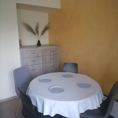 a room with a white table and chairs at M Art Apart in Sofia