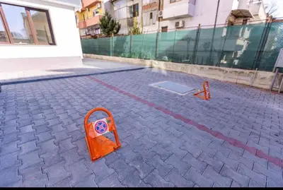 an orange object sitting on a brick street at Апартамент Узунови in Sandanski