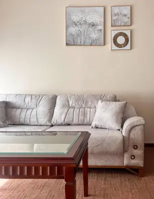 a living room with a couch and a coffee table at Next to the Ski Lift Downtown Bansko in Bansko