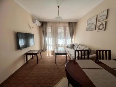 a living room with a couch and a table at Next to the Ski Lift Downtown Bansko in Bansko
