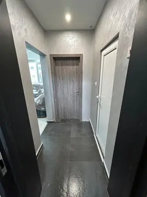 an empty hallway with a door and a hallway sidx sidx sidx at Paradise M Apartments in Plovdiv