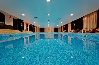 a large swimming pool in a hotel at Ski-in Ski-out Studio, Grand Monastery, Pamporovo in Pamporovo