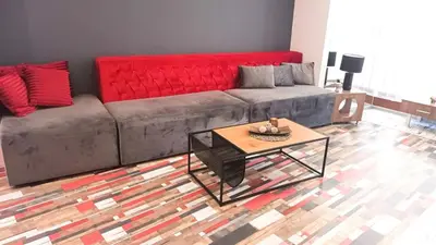 a living room with a couch and a coffee table at Boutique Apartment in Plovdiv