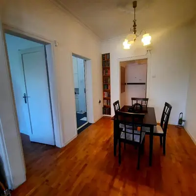 an empty living room with a table and chairs at Lovely 1 bdr apartment in Sofia city center in Sofia