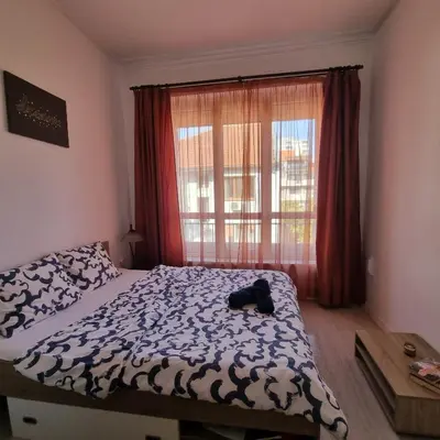 a bedroom with a bed and a window at Lovely 1 bdr apartment in Sofia city center in Sofia