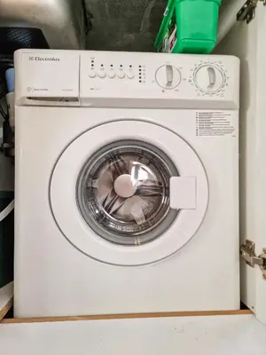 a white washing machine sitting in a room at Seasons stay Bansko in Bansko