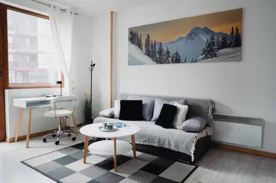 a living room with a couch and a table at Seasons stay Bansko in Bansko