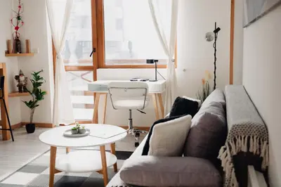 a living room with a couch and a table at Seasons stay Bansko in Bansko