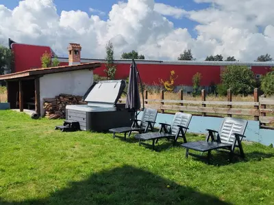 a group of chairs and a grill in a yard at Shekerdejiiski guest house bansko in Bansko